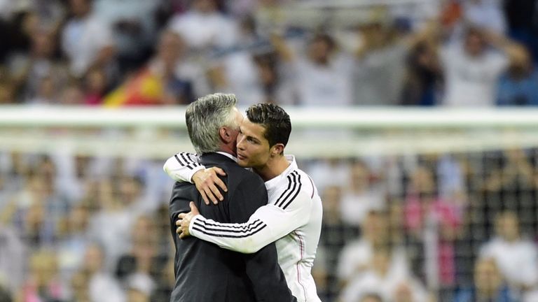 Real Madrid's coach Carlo Ancelotti (L) and forward Cristiano Ronaldo embrace after victory over Barcelona in October, 2014.