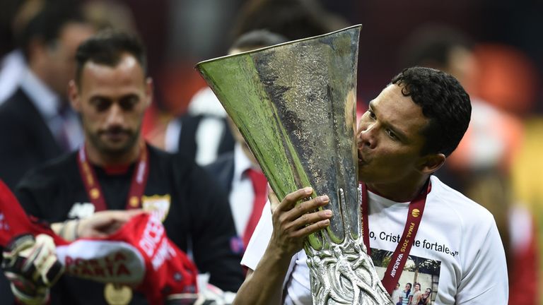 Sevilla forward Carlos Bacca with the Europa League trophy