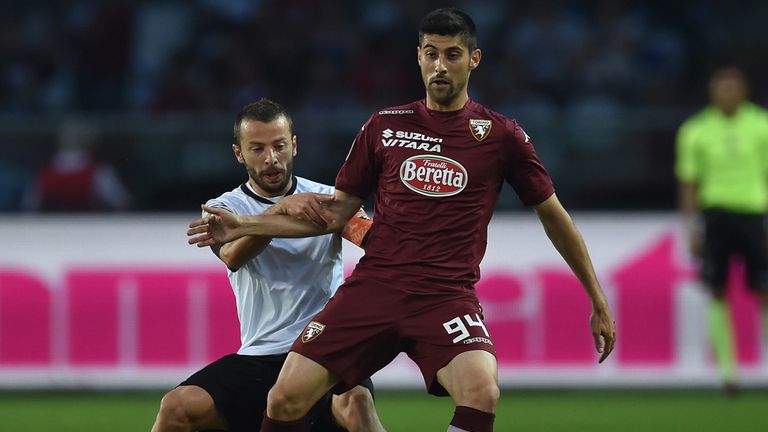 Marco Benassi (right) of Torino is challenged by Giuseppe De Feudis of Cesena