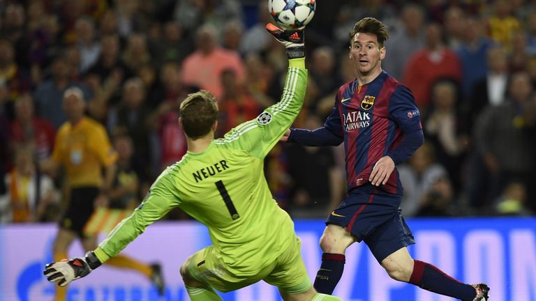 Barcelona's Argentinian forward Lionel Messi (R) scores a second goal 