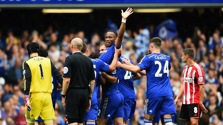 Didier Drogba of Chelsea is lifted by his team-mates as he is substituted 