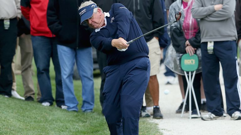 Colin Montgomerie hits his second shot at the 16th hole during the opening round of the  Senior PGA Championship in Indiana