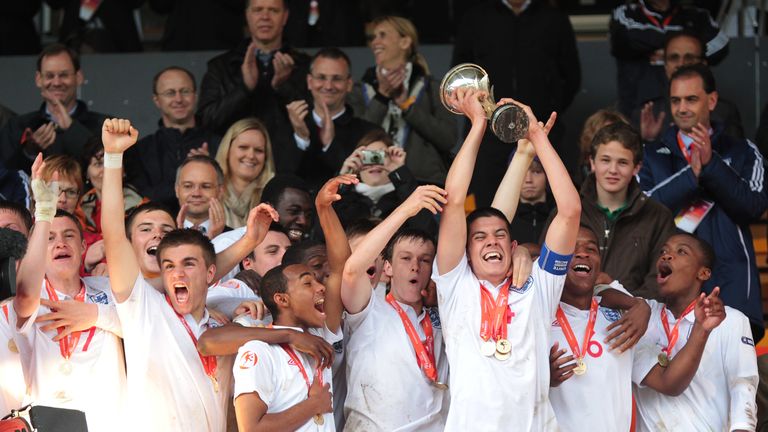 England's captain Conor Coady raises the trophy next to team-mates as they celebrate their victory overSpain at the 2010 European Under-17 Championship