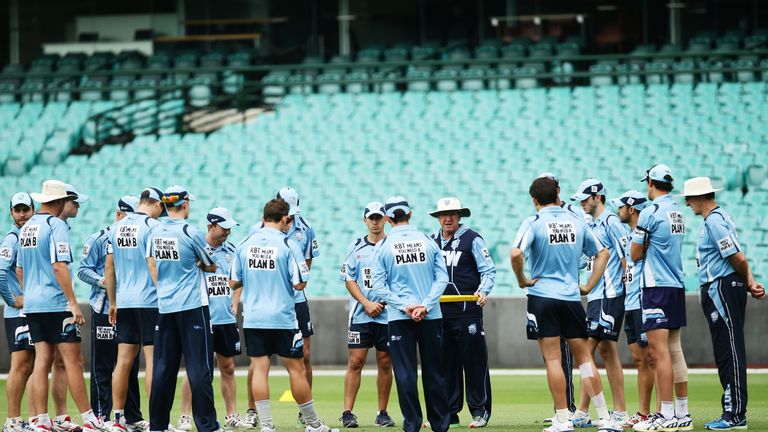 SYDNEY, AUSTRALIA - DECEMBER 09:  Blues coach Trevor Bayliss talks to his players during day one of the Sheffield Shield match between New South Wales and 