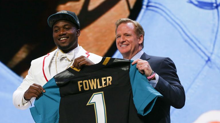 CHICAGO, IL - APRIL 30:  Dante Fowler Jr. of the Florida Gators holds up a jersey with NFL Commissioner Roger Goodell after being chosen #3 overall by the 