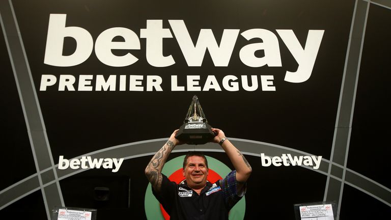 Gary Anderson celebrates with the Premier League trophy