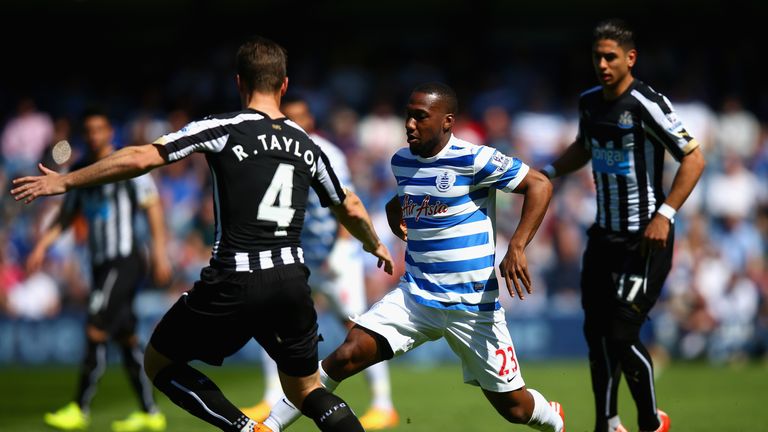 David Hoilett of QPR and Ryan Taylor of Newcastle United compete for the ball during their match at Loftus Road.