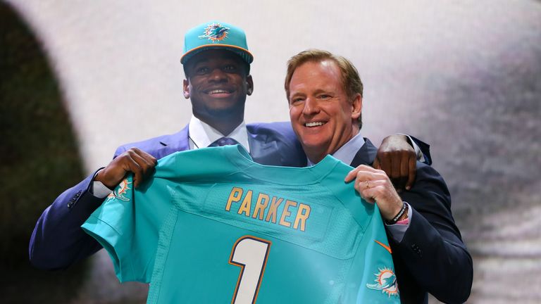 DeVante Parker of the Louisville Cardinals holds up a jersey with NFL Commissioner Roger Goodell