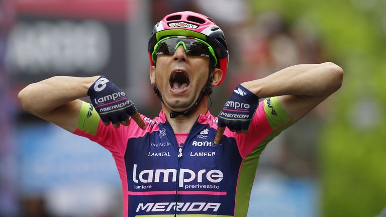 Italian cyclist Diego Ulissi celebrates as he crosses the finish line to win the 7th stage of the Giro d'Italia