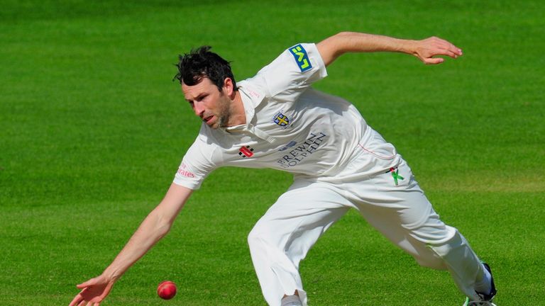 Durham bowler Graham Onions fields off his own bowling before running out Warwickshire batsman Jeetan Patel