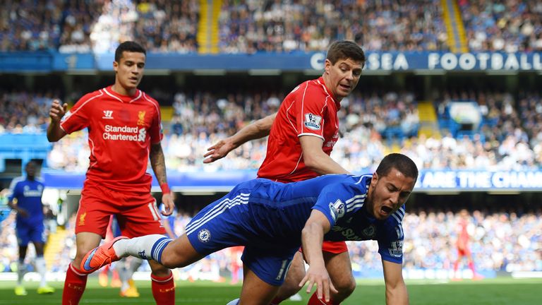 Eden Hazard is pushed over by Steven Gerrard 
