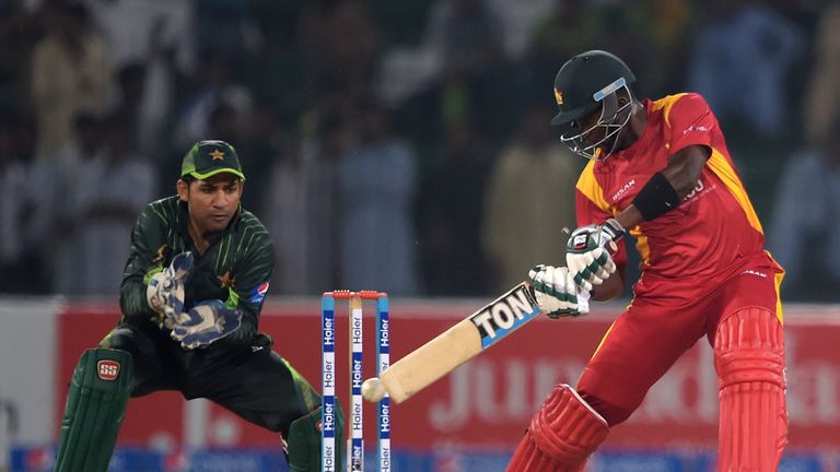 Zimbabwe's captain Elton Chigumbura (R) plays a shot against Pakistan.