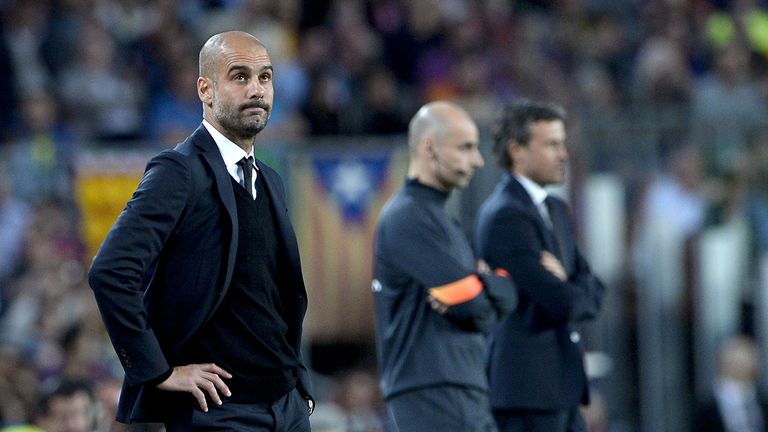 Pep Guardiola (L) stands in the sidelines against Barcelona at the Camp Nou stadium in Barcelona on May 6, 2015.     