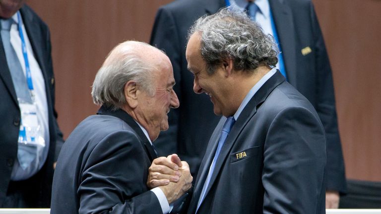 FIFA President Joseph S. Blatter (L) shakes hands with UEFA president Michel Platini during the 65th FIFA Congress at Zurich