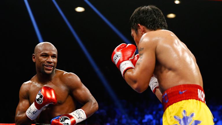 Floyd Mayweather Jr. smiles at Manny Pacquiao during their welterweight unification championship bout on May 2, 2015.