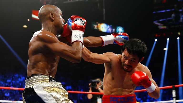 Floyd Mayweather Jr. and Manny Pacquiao exchange punches during their welterweight unification championship bout on May 2, 2015.