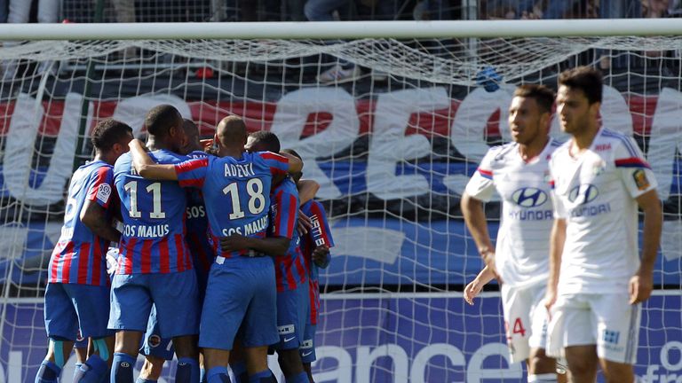 Caen players celebrate after Nicolas Benezet scores