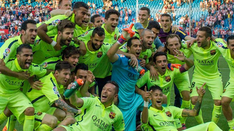 Barcelona players celebrate winning the 2014/15 Spanish championship