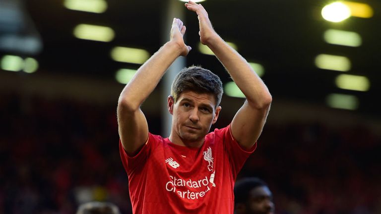 Steven Gerrard of Liverpool applauds the fans as he walks a lap of honour after his final game at Anfield