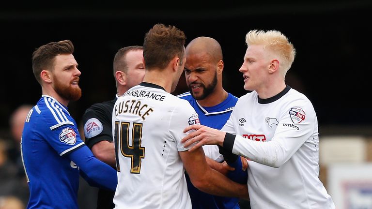 IPSWICH, ENGLAND - JANUARY 10:  David McGoldrick of Ipswich Town and John Eustace of Derby County clash during the Sky Bet Championship match between Ipswi