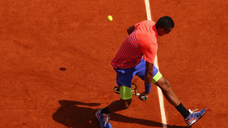 Nick Kyrgios of Australia returns a shot in his Men's Singles match against Andy Murray of Great Britain on day seven of the 2015 French Open 