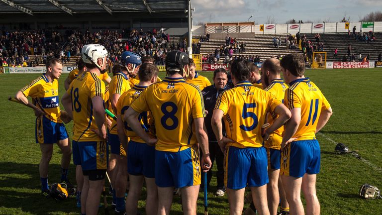 The Clare manager Davy Fitzgerald speaks to his players after their loss to Kilkenny