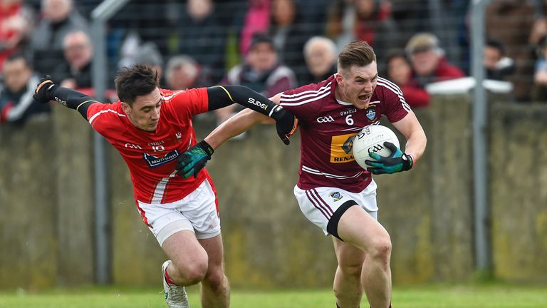 Kieran Martin Westmeath is tackled by Derek Maguire Louth