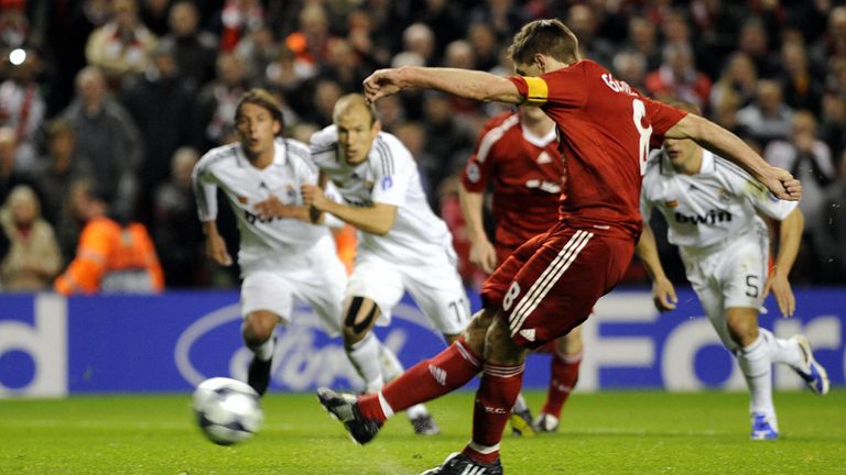 Liverpool's English midfielder Steven Gerrard (C) scores his second goal from a penalty during their UEFA Champions League second round, second leg footbal