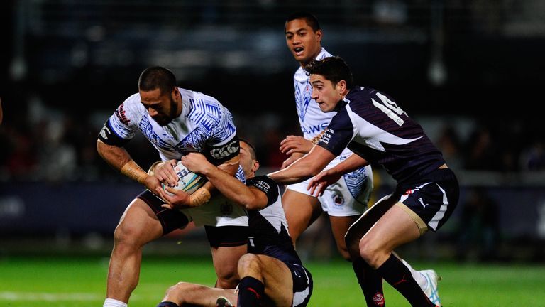 Tony Gigot (R) in action for France during the Rugby League World Cup.