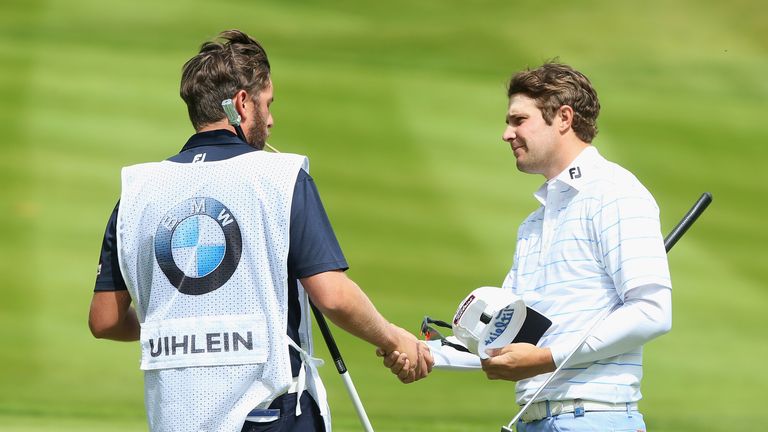 VIRGINIA WATER, ENGLAND - MAY 23:  Peter Uihlein of the United States shakes hands with his caddie on the18th green during day 3 of the BMW PGA Championshi