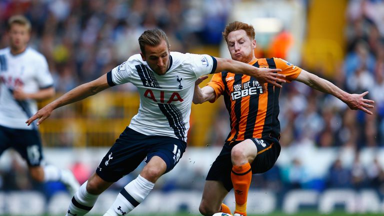 Tottenham's Harry Kane shrugs off the challenge of Hull's Stephen Quinn.