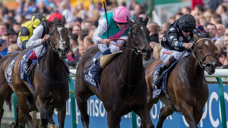 Bragging ridden by Ryan Moore (centre) gets the better of Kleo ridden by Adam Kirby to win the Charm Spirit Dahlia Stakes Race run during the QIPCO 1000 Gu
