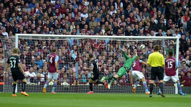 Danny Ings of Burnley scores with a header at Villa Park