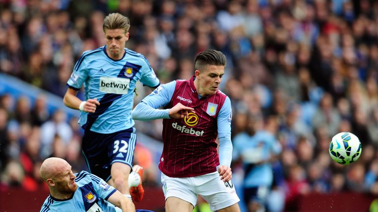 Jack Grealish is tackled by James Collins 