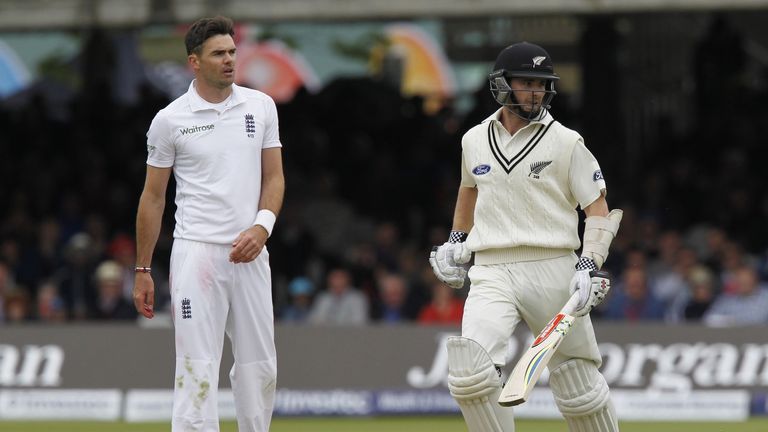 New Zealand's Kane Williamson (R) runs after a shot as England's James Anderson watches