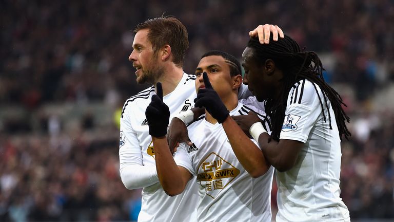 Jefferson Montero celebrates scoring Swansea's first goal with his team mates Gylfi Sigurdsson and Marvin Emnes during their game with Stoke City. 