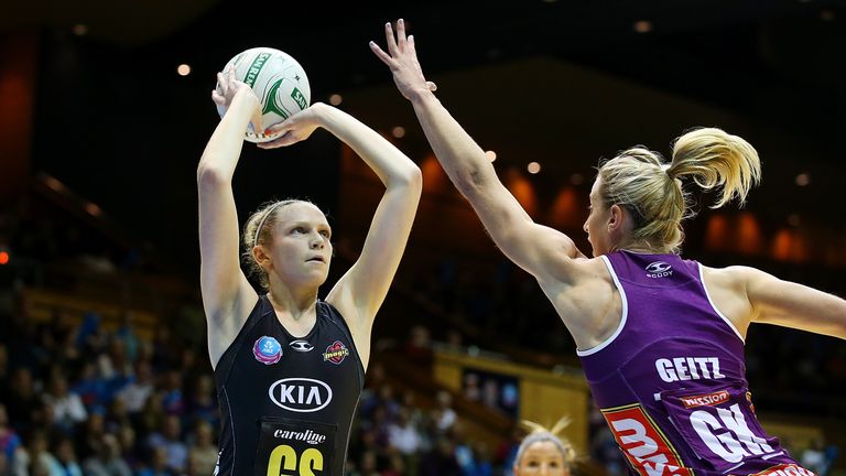 Jo Harten of the Magic shoots for goal over Laura Geitz of the Firebirds during the ANZ Championship Preliminary Final matc