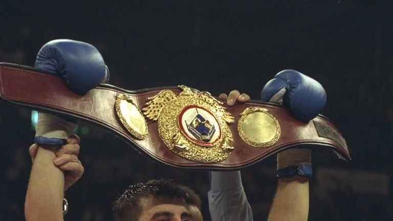 11 Oct 1997:  Joe Calzaghe of Britain celebrates with his championship belt after beating Chris Eubank of Britain on points to win the WBO Super-Middleweig