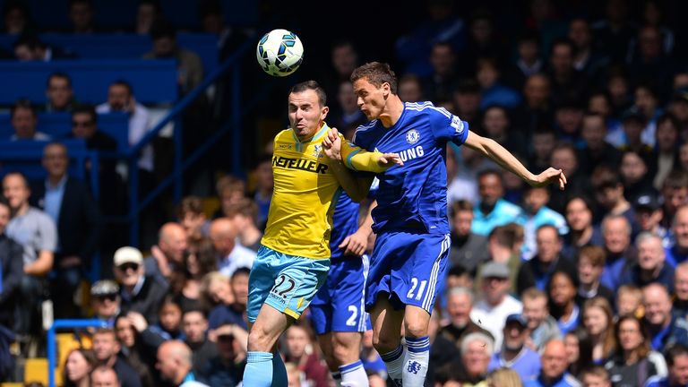 Crystal Palace's midfielder Jordon Mutch (L) jumps for a header with Chelsea's midfielder Nemanja Matic. AFP PHOTO / GLYN KIRKn