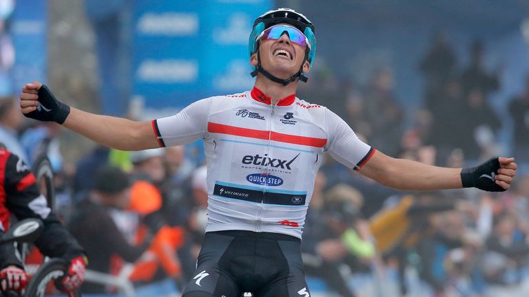 Julian Alaphilippe of France riding for Etixx - Quick-Step celebrates as he wins stage seven and claims the overall race lea