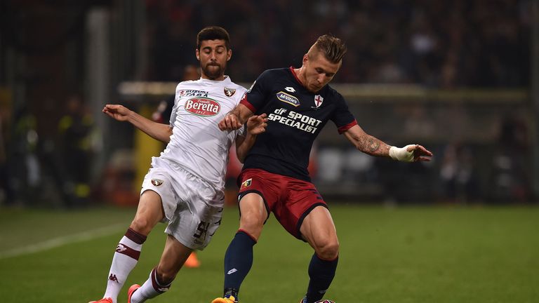GENOA, ITALY - MAY 11:  Juraj Kucka (L) of Genoa CFC is challenged by Marco Benassi of Torino FC during the Serie 