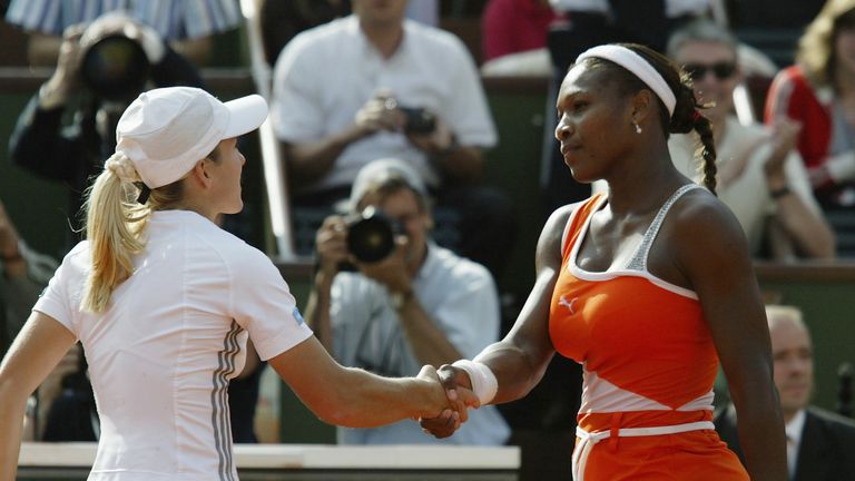 Justine Henin shakes hands with Serena Williams after her victory in their semi-final during the 11th day of the French Open 