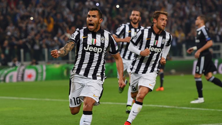 Carlos Tevez of Juventus (10) celebrates with Claudio Marchisio (8) as he scores their second goal 