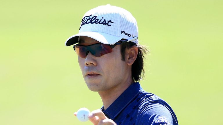 PONTE VEDRA BEACH, FL - MAY 09:  Kevin Na holds up his ball after putting on the eighth green during round three of THE PLAYERS Championship at the TPC Saw