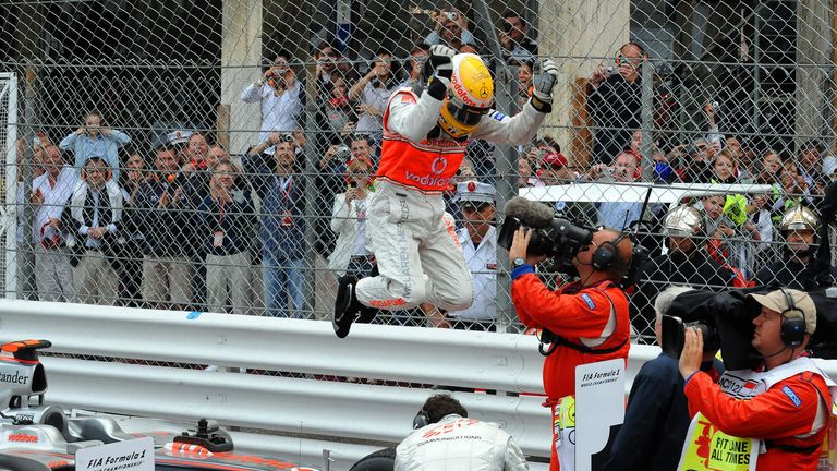 Hamilton celebrates winning the Monaco GP for the first time
