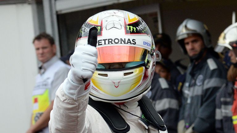 Lewis Hamilton celebrates taking the pole