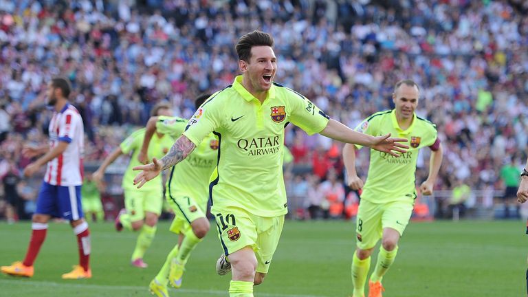 Lionel Messi celebrates after scoring Barcelona's opening goal during the La Liga match against Atletico Madrid on May 17, 2015