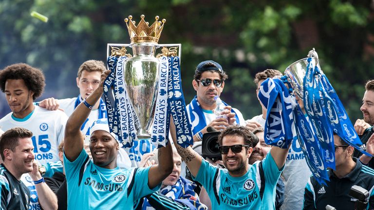 Chelsea's Didier Drogba (left) and Cesc Fabregas with the trophy during a parade to celebrate winning the Barclays Premier League, in London. PRESS ASSOCIA
