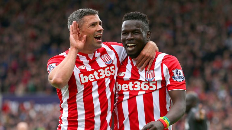 Mame Biram Diouf celebrates scoring a goal with his team mate Jonathan Walters during the game between Stoke and Liverpool