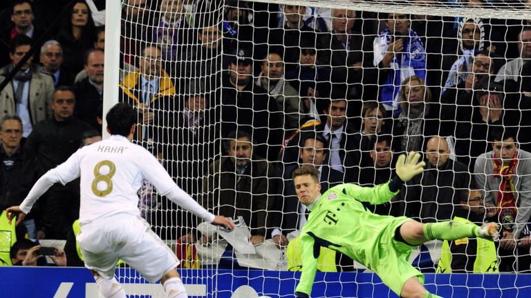 Bayern Munich's goalkeeper Manuel Neuer (R) stops a penalty kick from Real Madrid's Brazilian midfielder Kaka (L) during the UEFA Champions League second l